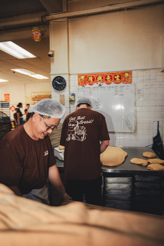 bakery team kneading bread in bakery in get that bread brown graphic t shirt