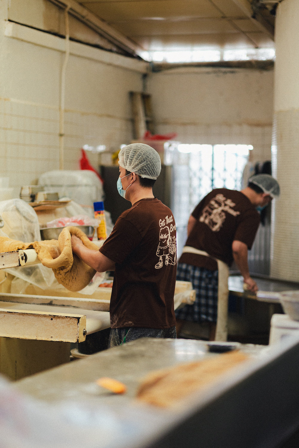 man baking dough in bakery in get that bread t shirt
